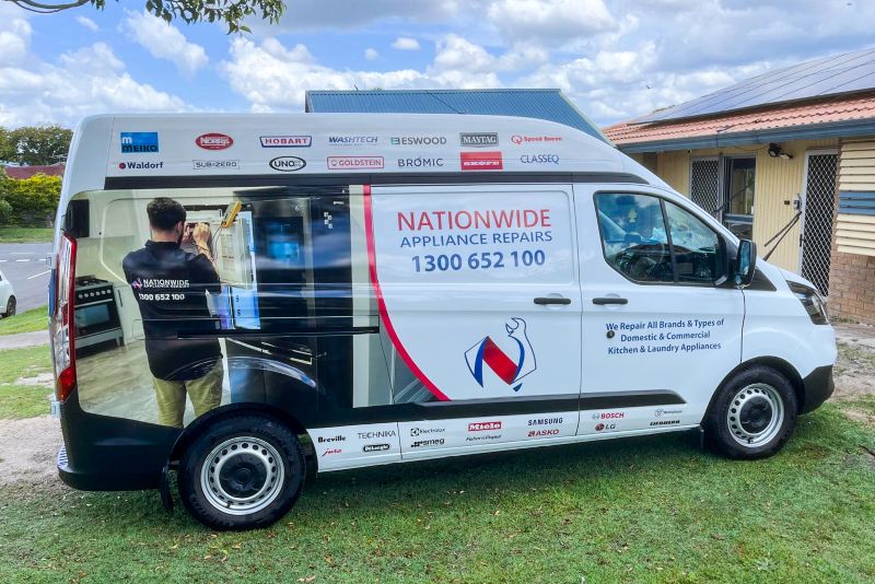 Technician repairing an appliance