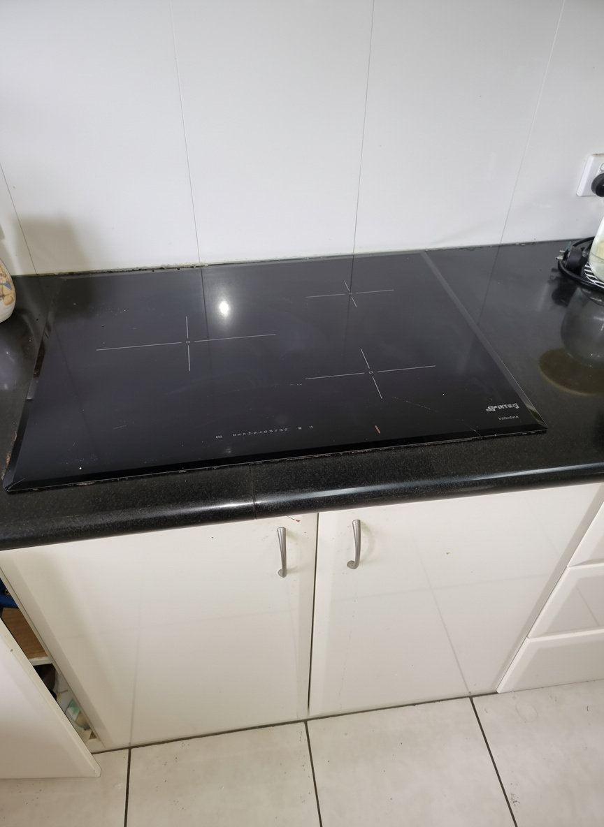 Technician repairing an appliance